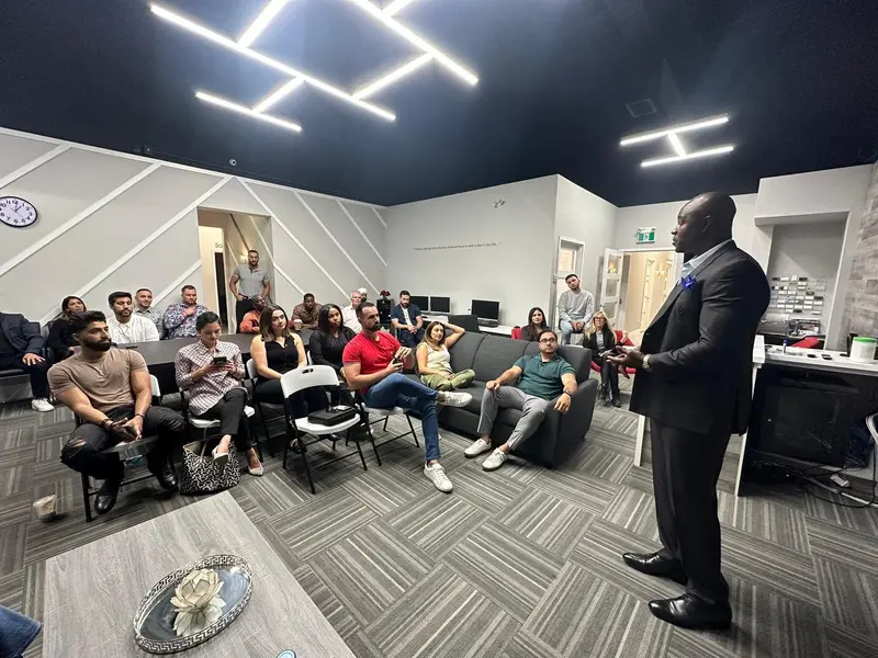 Gary Durrant speaking to professionals in a modern office